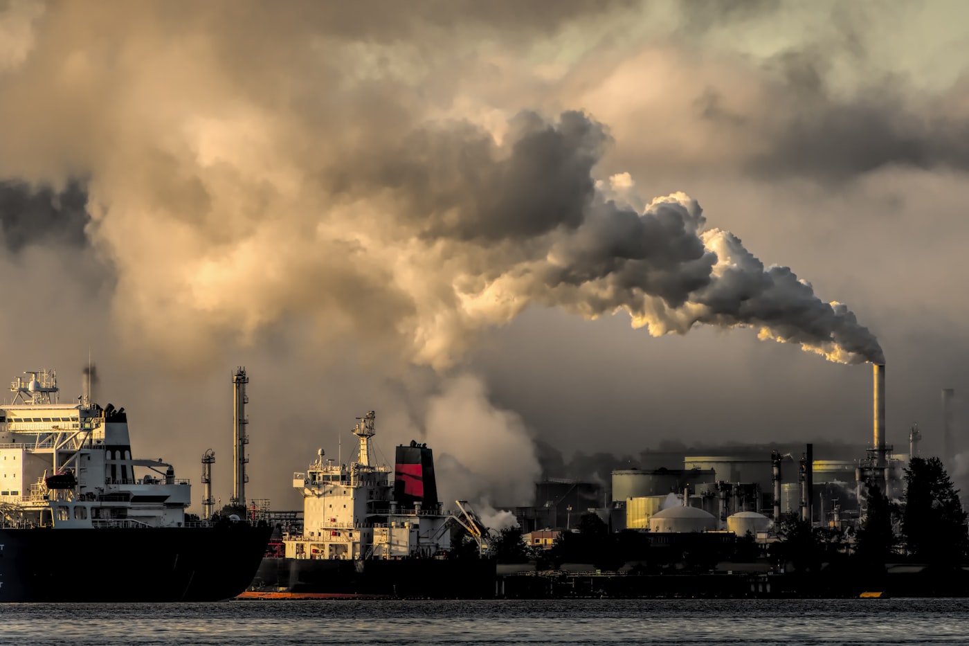 Industrial emissions at sunset, a reminder of the climate change impact